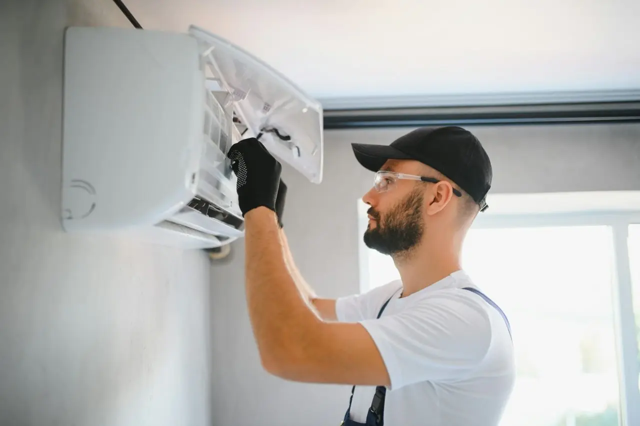male technicians service for repair and maintenance of air conditioners